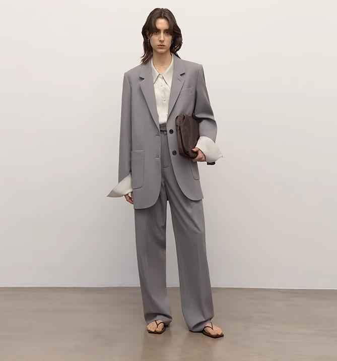 Women's classic two-button loose straight wool blazer featuring an asymmetrical collar design.
