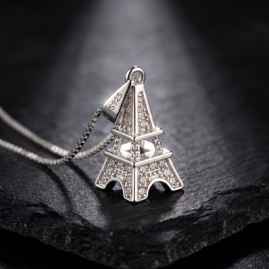 Luxury 925 Sterling Silver Eiffel Tower Pendant Necklace featuring pavé zirconia crystals, visible S925 hallmark, and elegant box chain showcased on a premium black stone background.