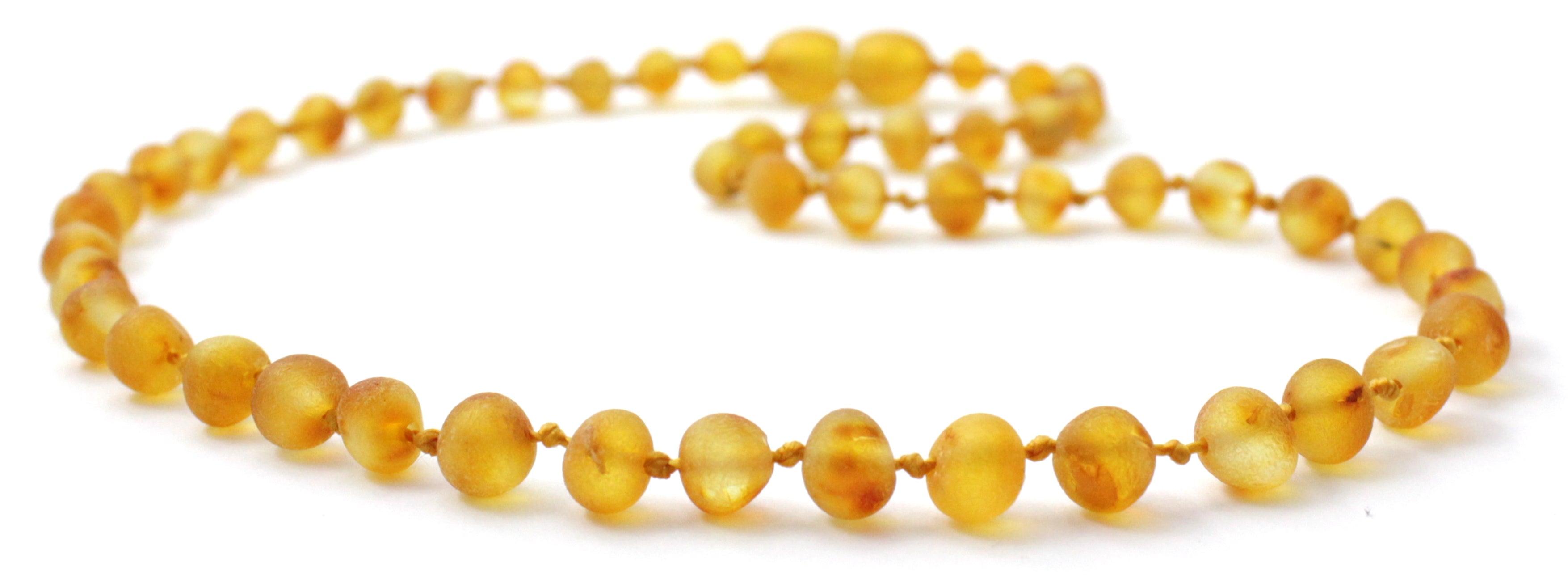 Unpolished raw honey golden Baltic amber children's necklace with oval baroque beads on yellow string — view 3
