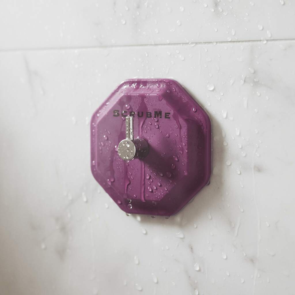Self adhesive wall hook on a smooth bathroom tile holding a blue hanging shower towel — view 5