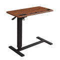 Light brown height adjustable standing desk with steel frame and built in charging ports