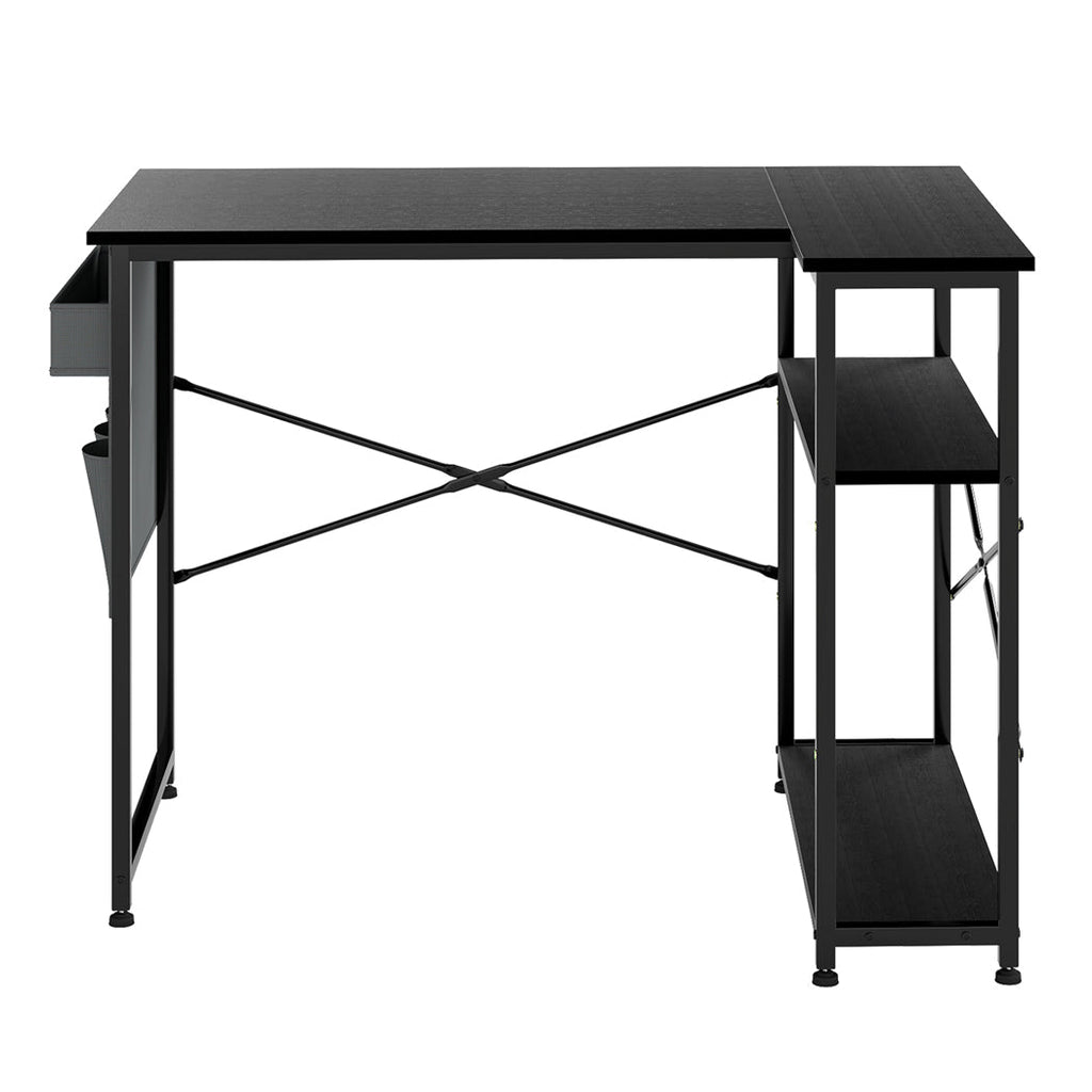 Black L-shaped gaming computer desk with steel frame and fabric storage bag for modern offices.