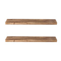 Two natural Paulownia wood floating shelves mounted on a wall displaying decorative living room items