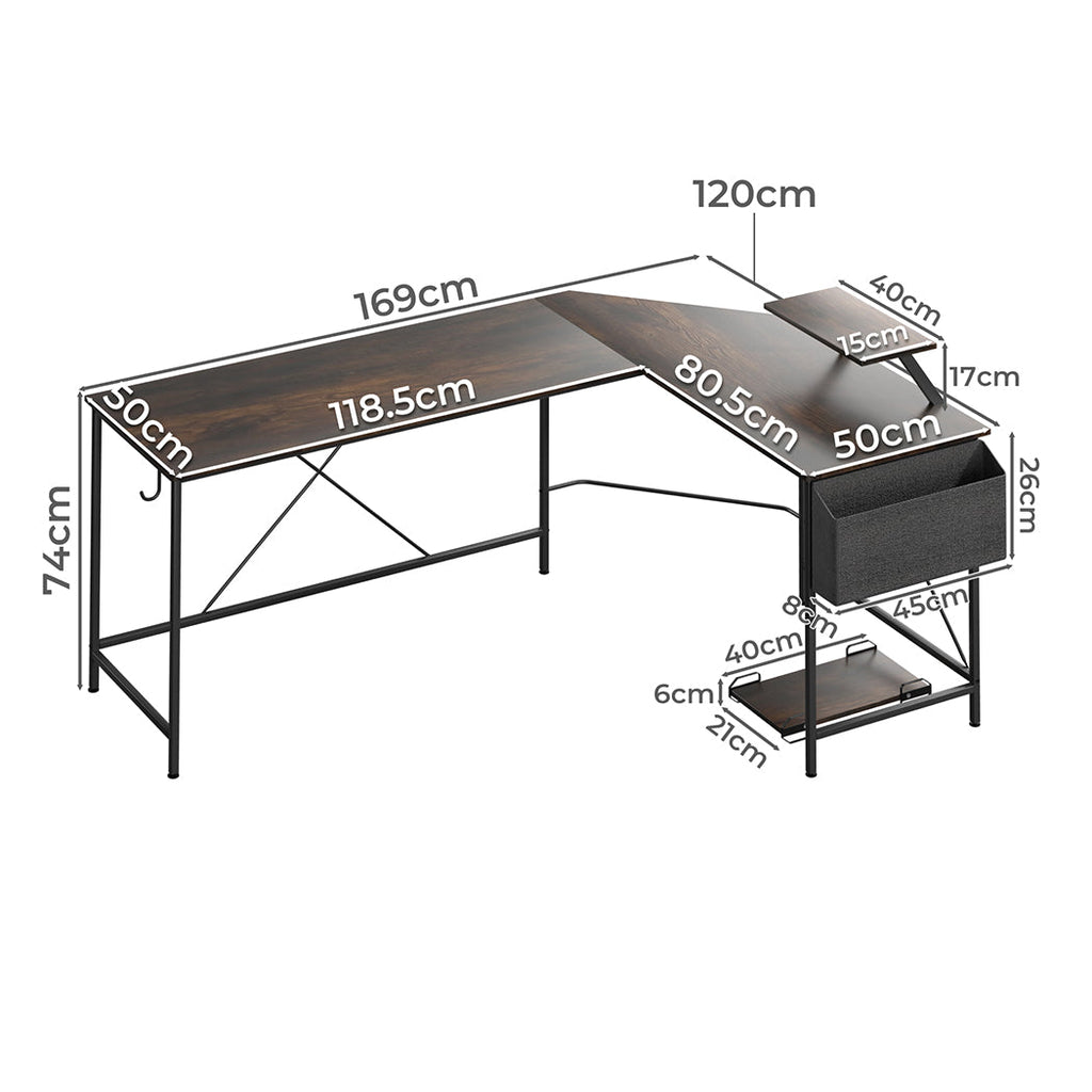 Brown L-shaped wooden computer desk with steel frame, movable monitor stand, and attached storage bag. — view 2