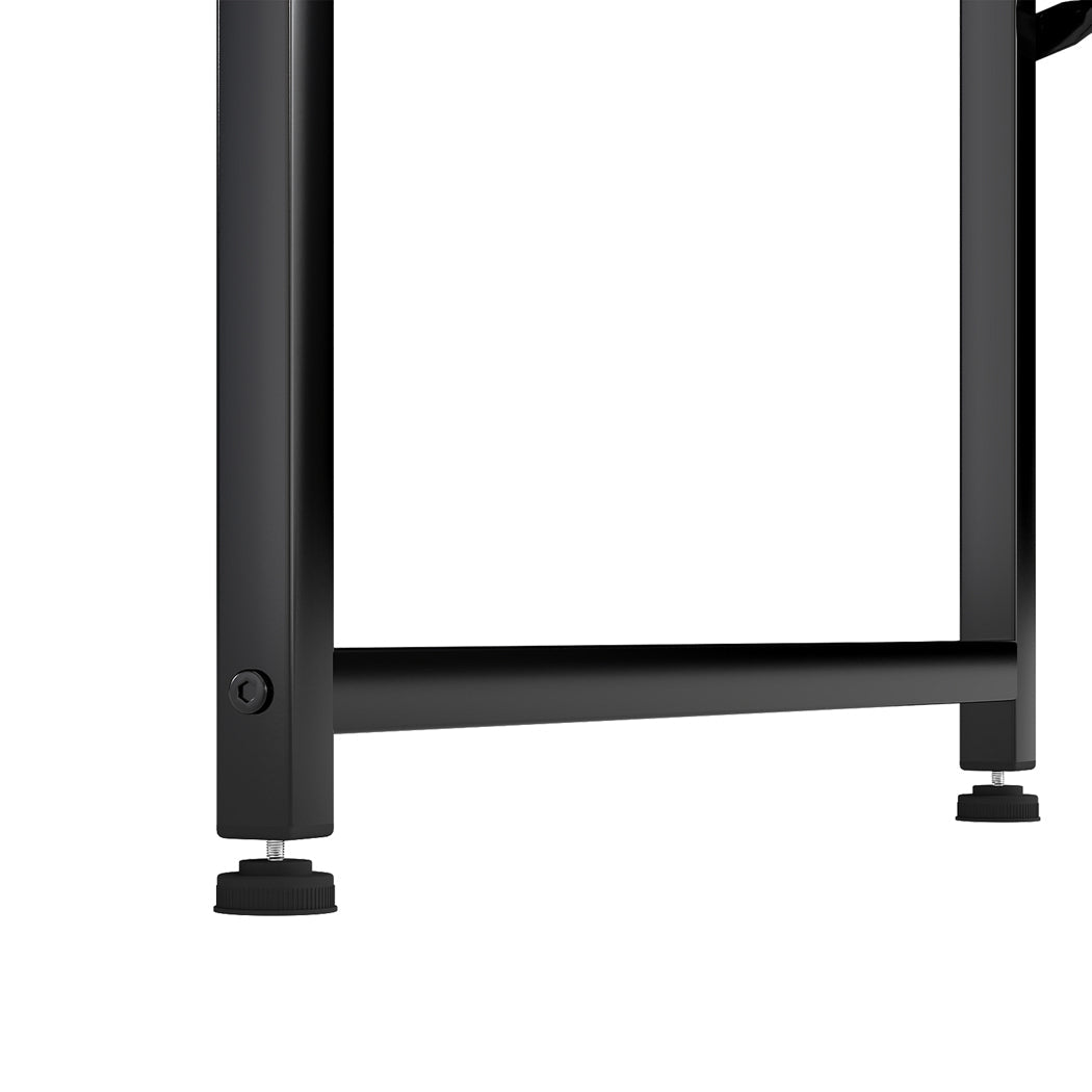 Black L-shaped gaming computer desk with steel frame and fabric storage bag for modern offices. — view 3