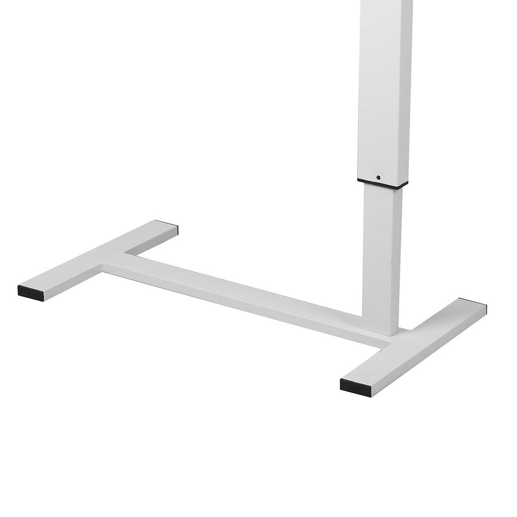Marbled white adjustable standing desk with steel frame and hidden wheels next to a modern sofa — view 3