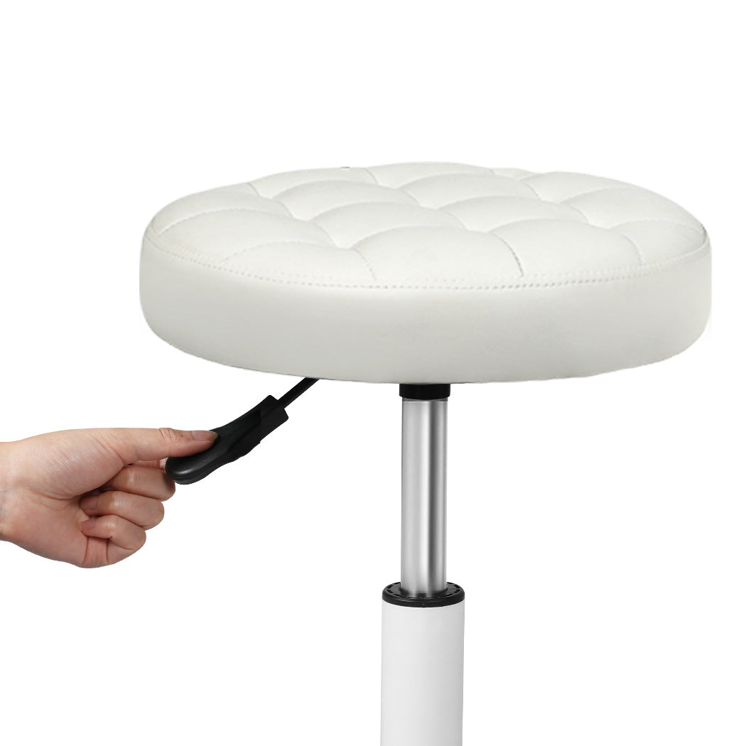 Beige PU leather rolling salon stool with 360 degree swivel wheels and adjustable steel frame — view 3