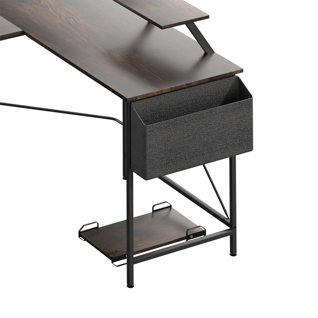 Brown L-shaped wooden computer desk with steel frame, movable monitor stand, and attached storage bag. — view 3