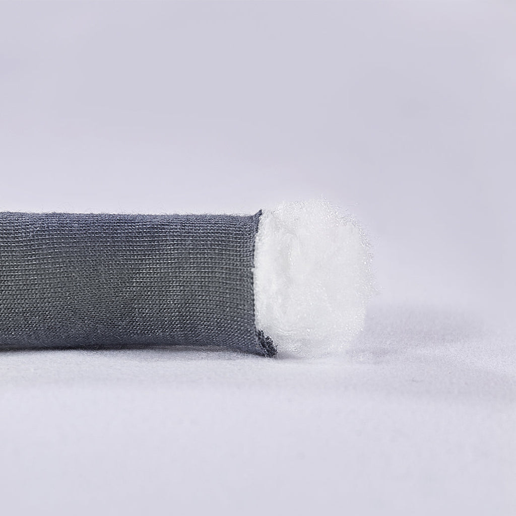 Chunky grey knitted weighted blanket folded neatly on a bed for anxiety relief and restful sleep — view 3