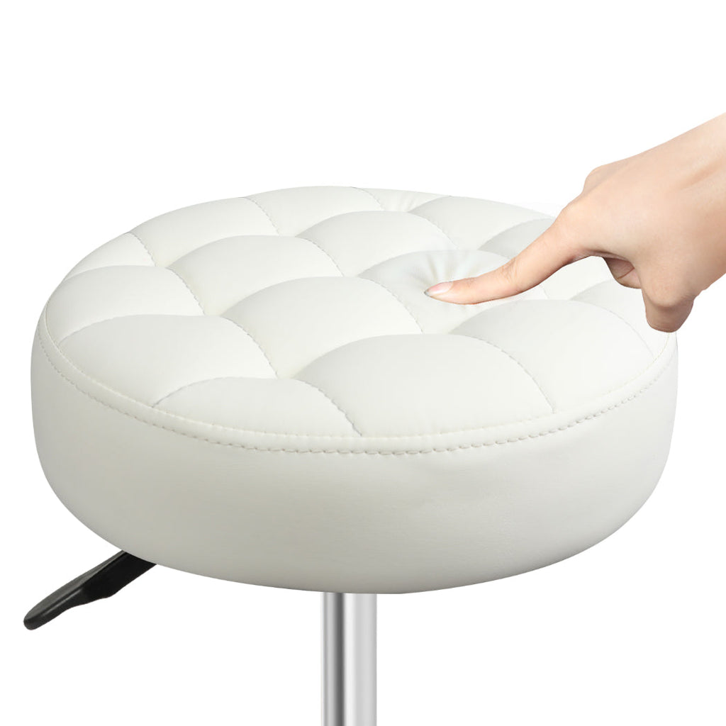 Beige PU leather rolling salon stool with 360 degree swivel wheels and adjustable steel frame — view 4