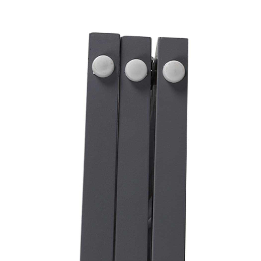 Grey wooden freestanding three panel pet gate folded out on a flat floor surface — view 5