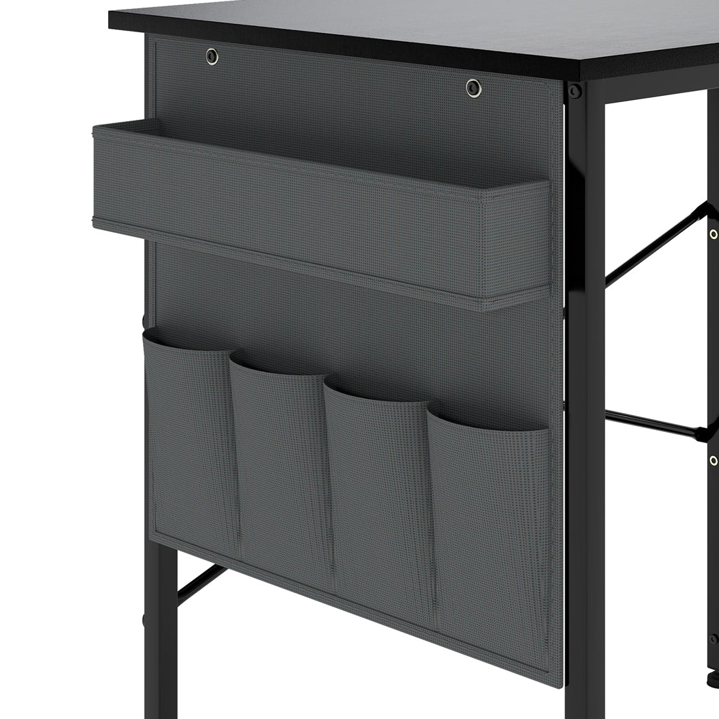 Black L-shaped gaming computer desk with steel frame and fabric storage bag for modern offices. — view 5