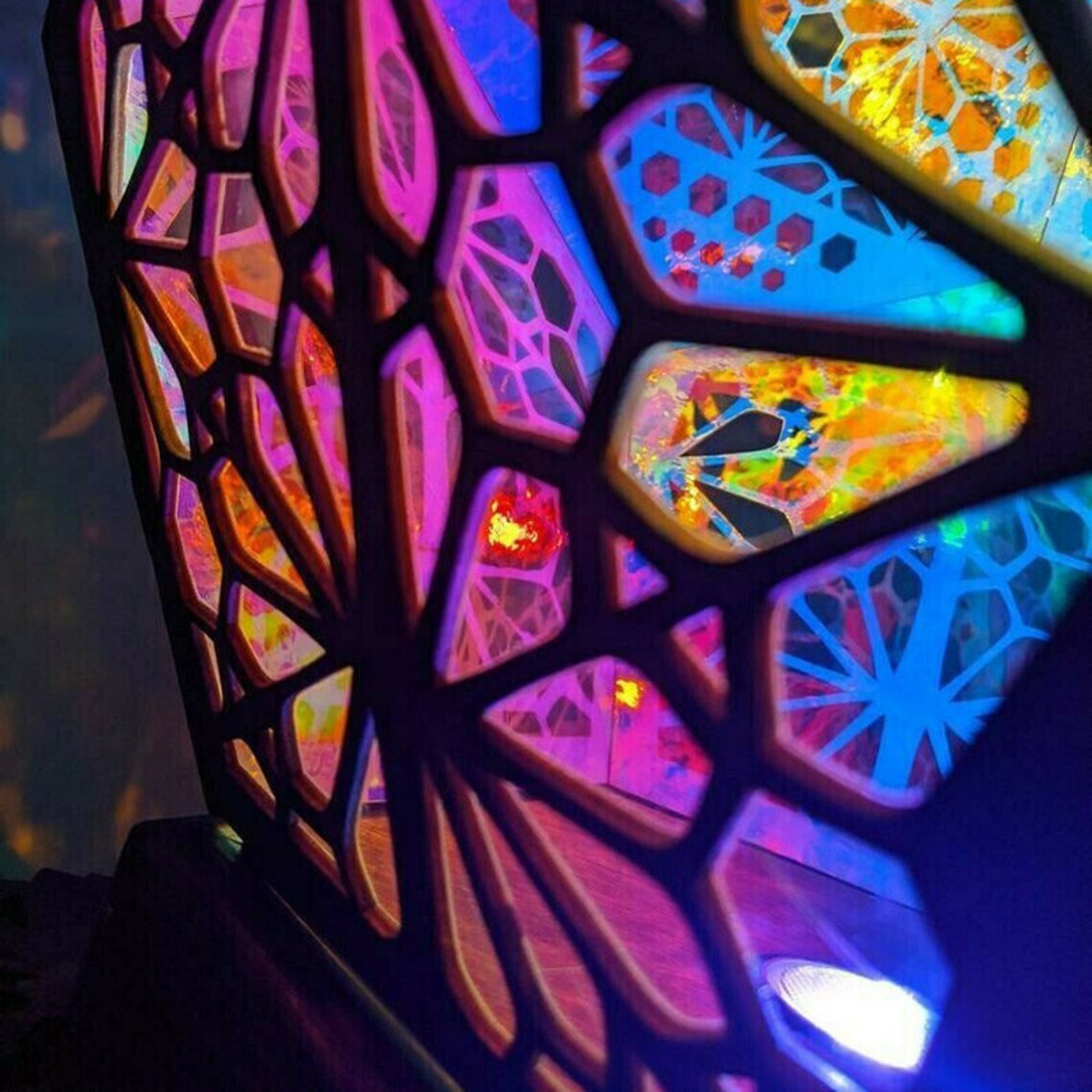 Bohemian wooden table lamp projecting colorful 3D star patterns from a diamond shaped basswood frame — view 3