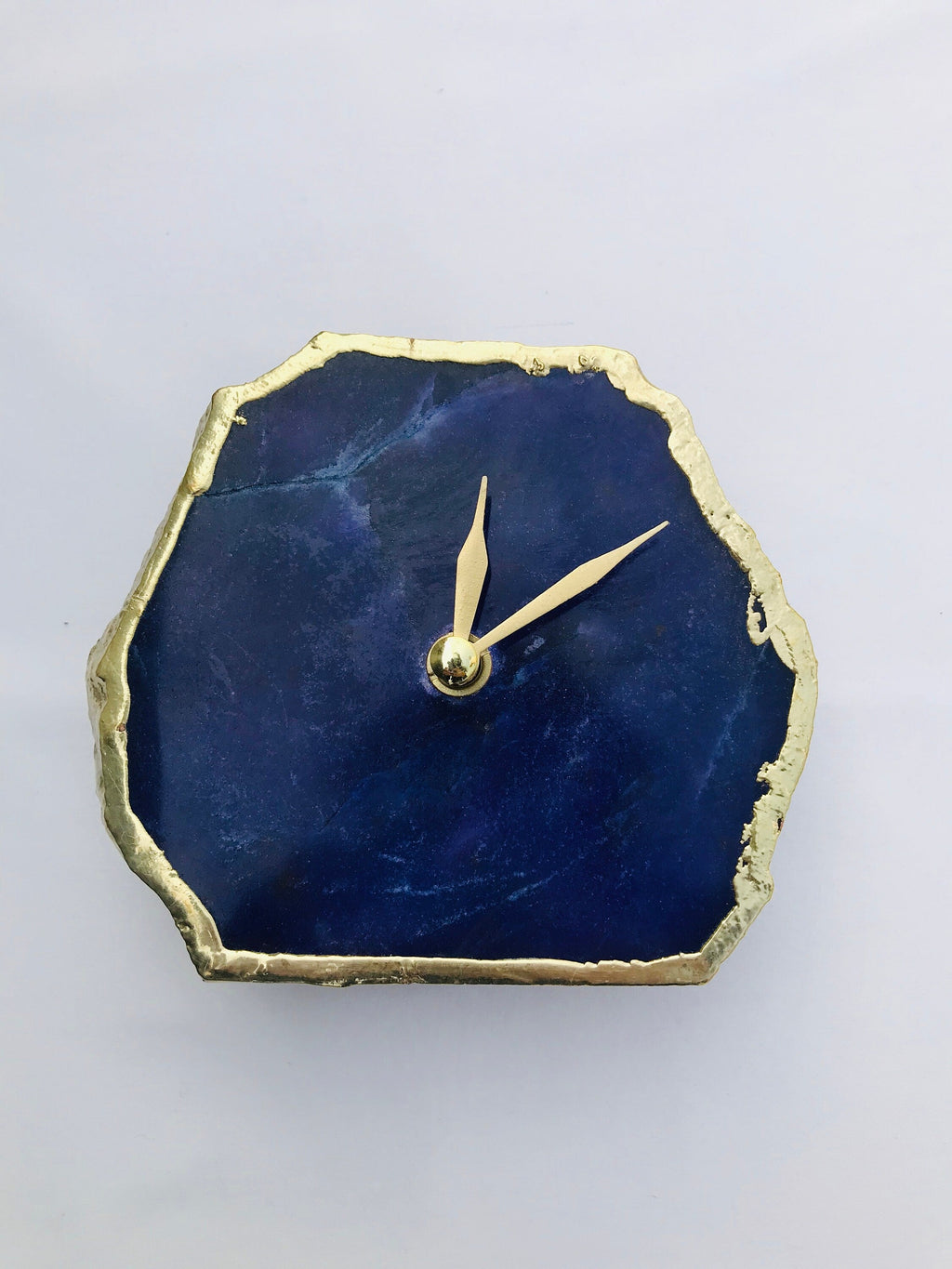 Indigo blue agate desk clock with metallic gold edges and modern brass hands on metal base — view 2