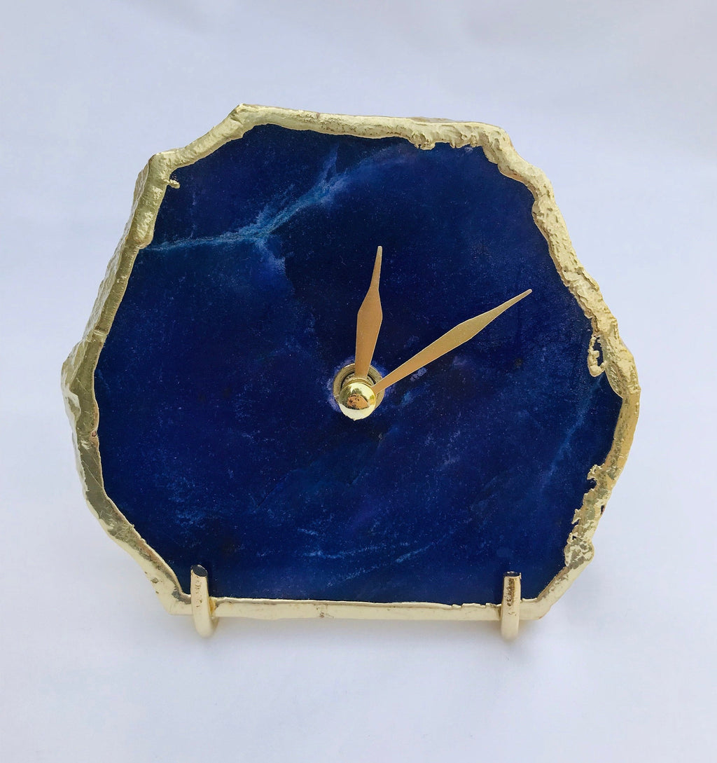 Indigo blue agate desk clock with metallic gold edges and modern brass hands on metal base