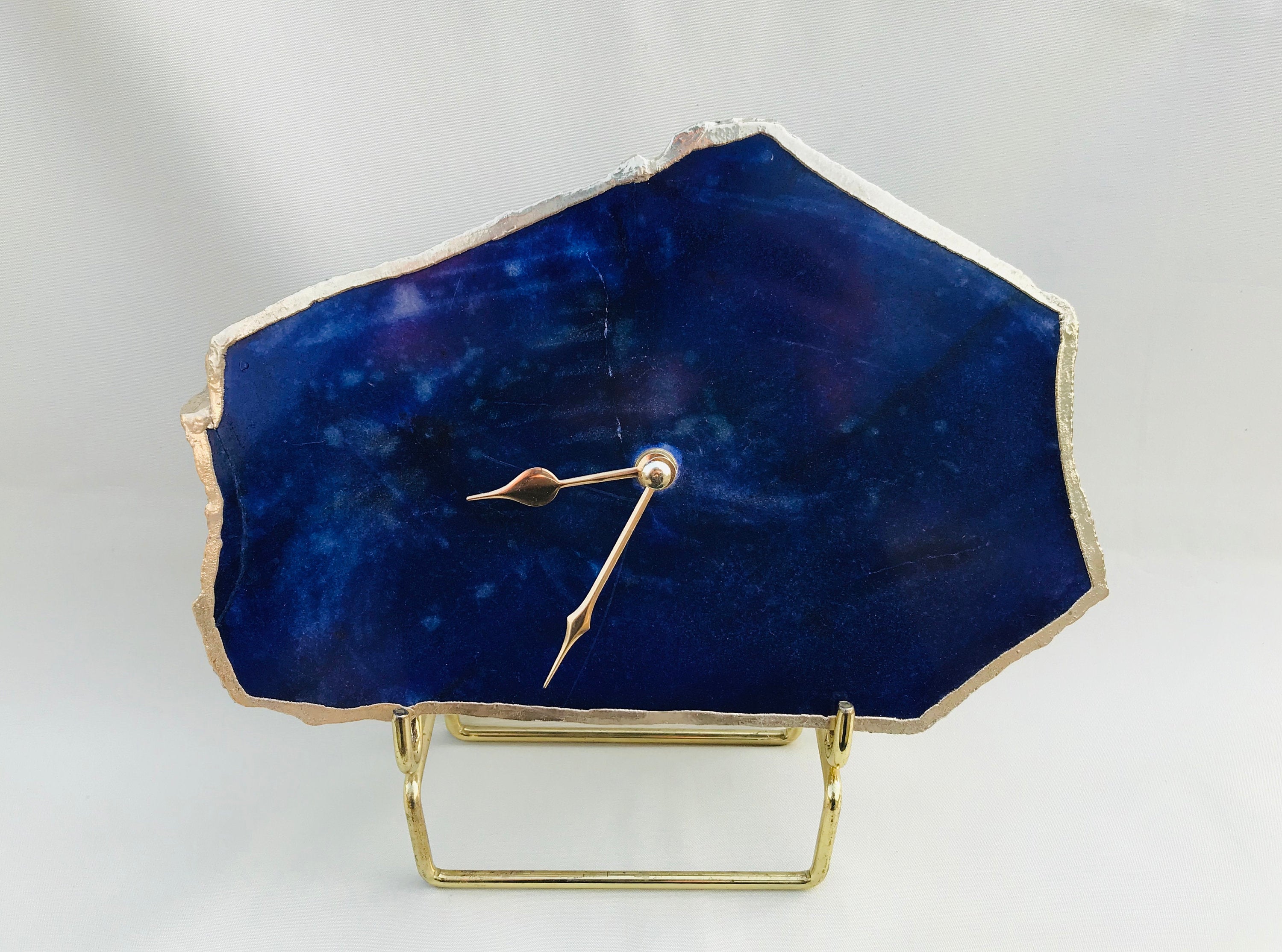 Irregular indigo blue agate quartz clock with electroplated gold edges and modern brass finish hands