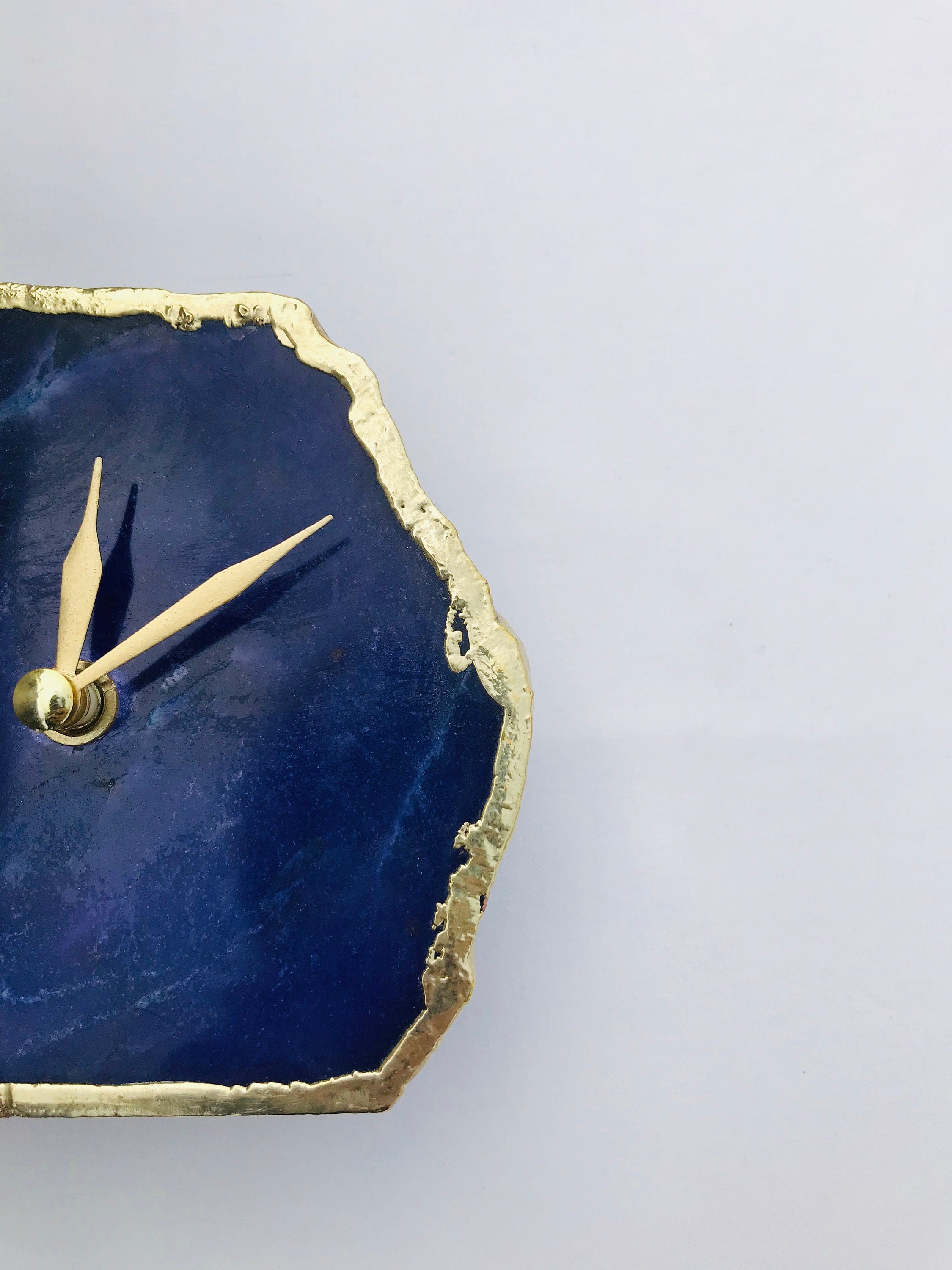 Indigo blue agate desk clock with metallic gold edges and modern brass hands on metal base — view 4