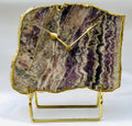 Irregular shaped natural purple amethyst quartz clock with gold electroplated edges and modern brass hands