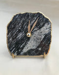 Black and white zebra agate desk clock with metallic gold edges and brass hands