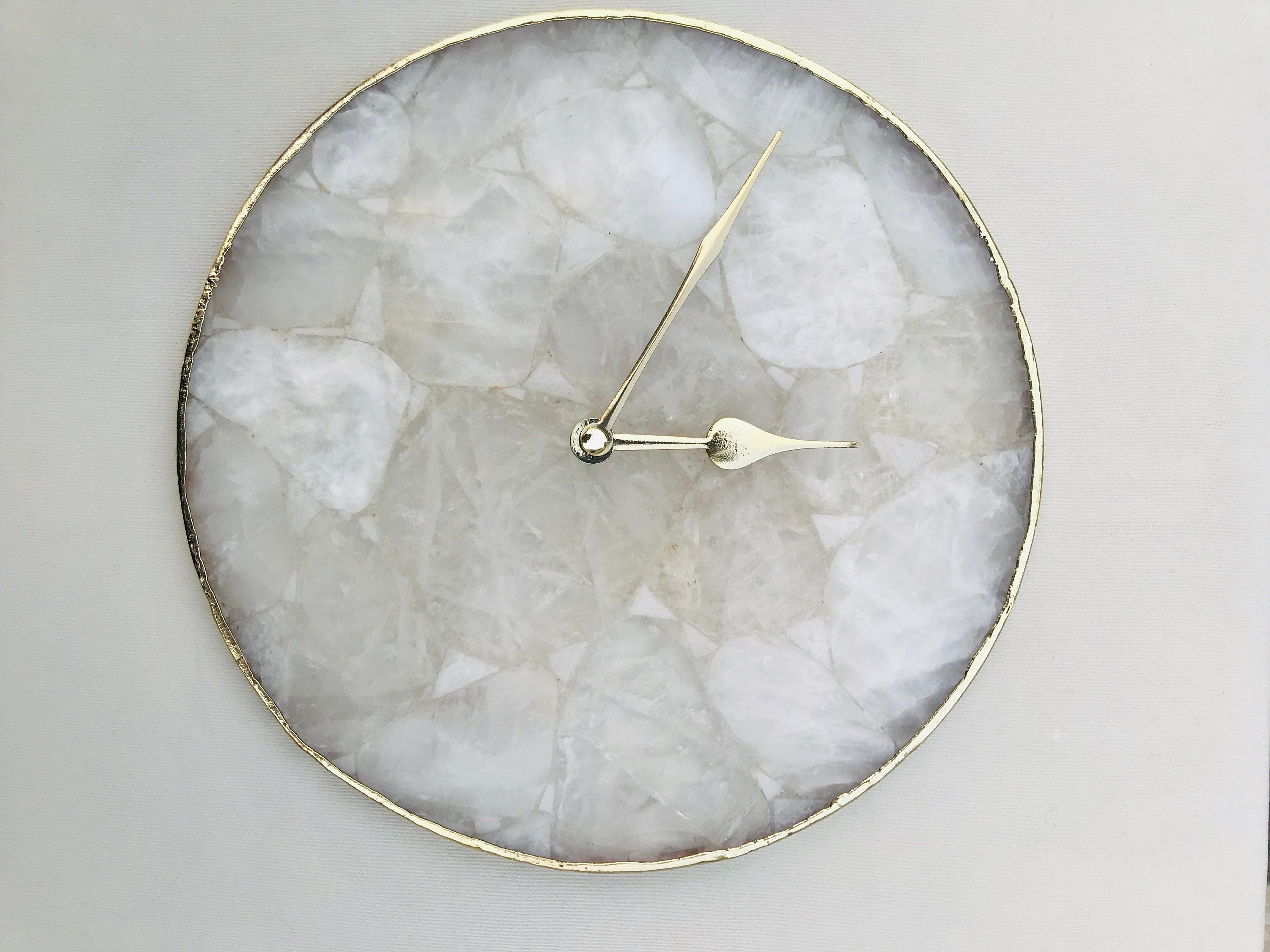 Clear crystal agate wall clock with gold electroplated edges and modern brass hands