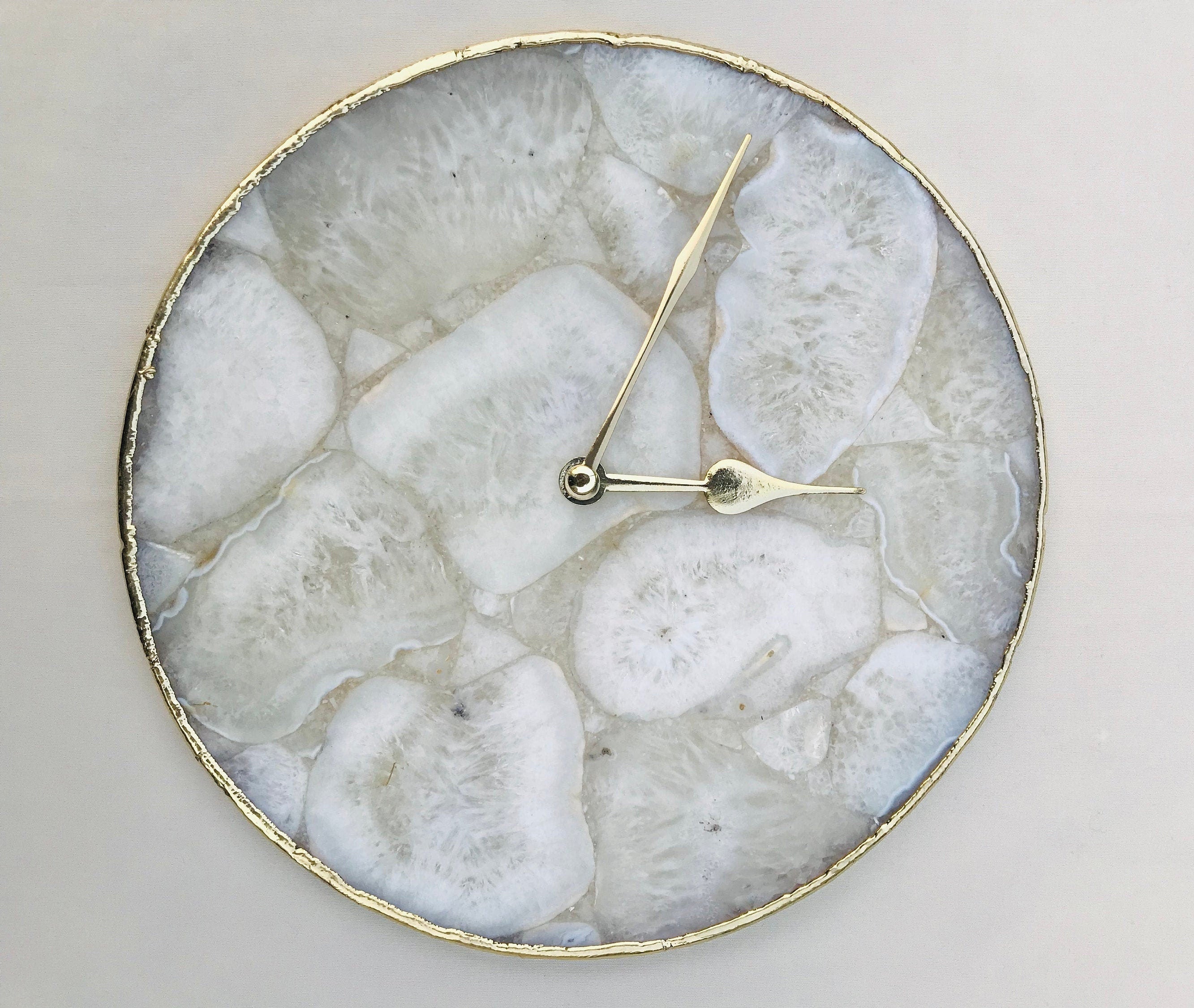 10 inch round white crystal agate wall clock with metallic gold edges and brass hands