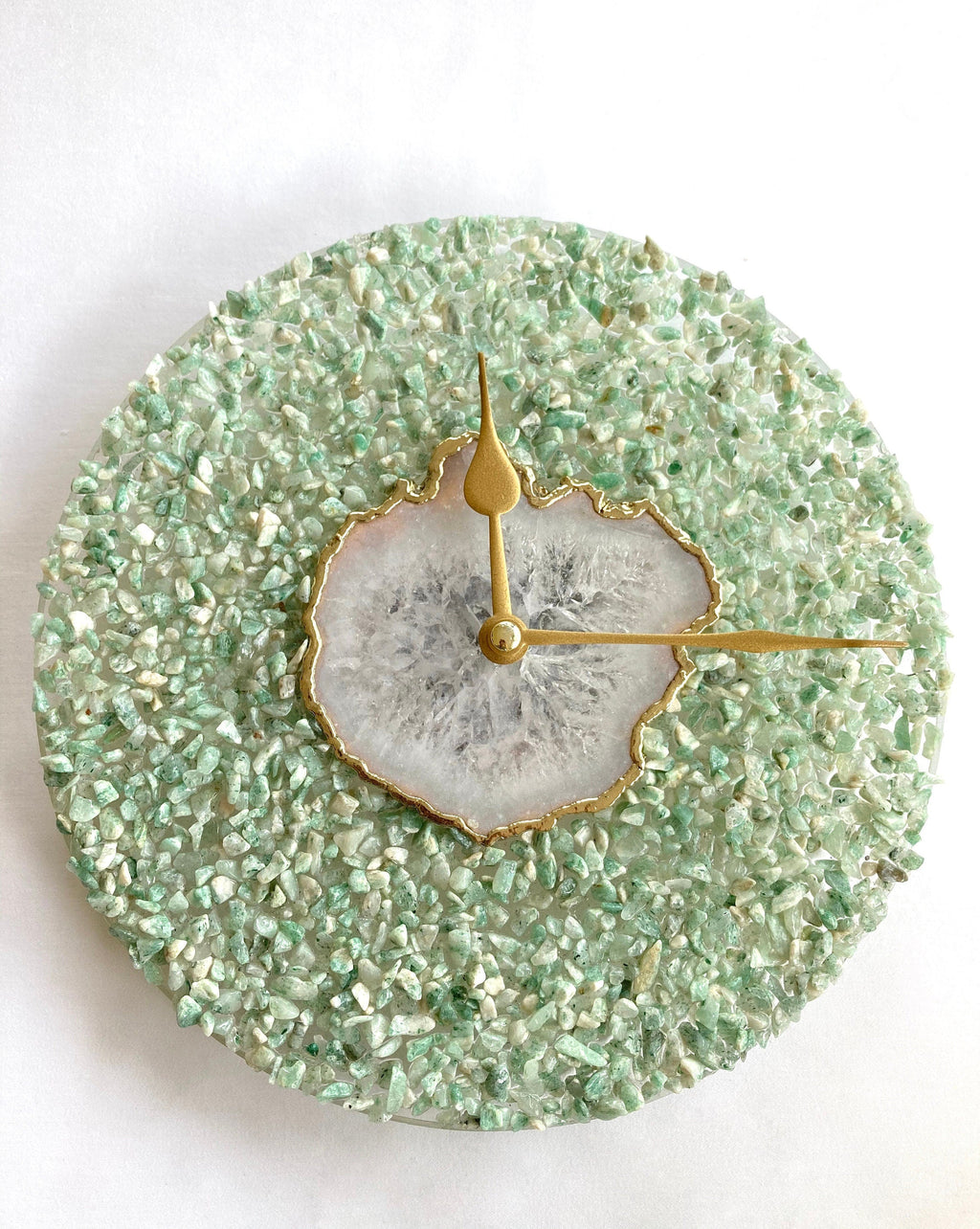 Green crystal and white agate 10-inch round wall clock with gold edges and brass hands