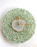 Green crystal and white agate 10-inch round wall clock with gold edges and brass hands