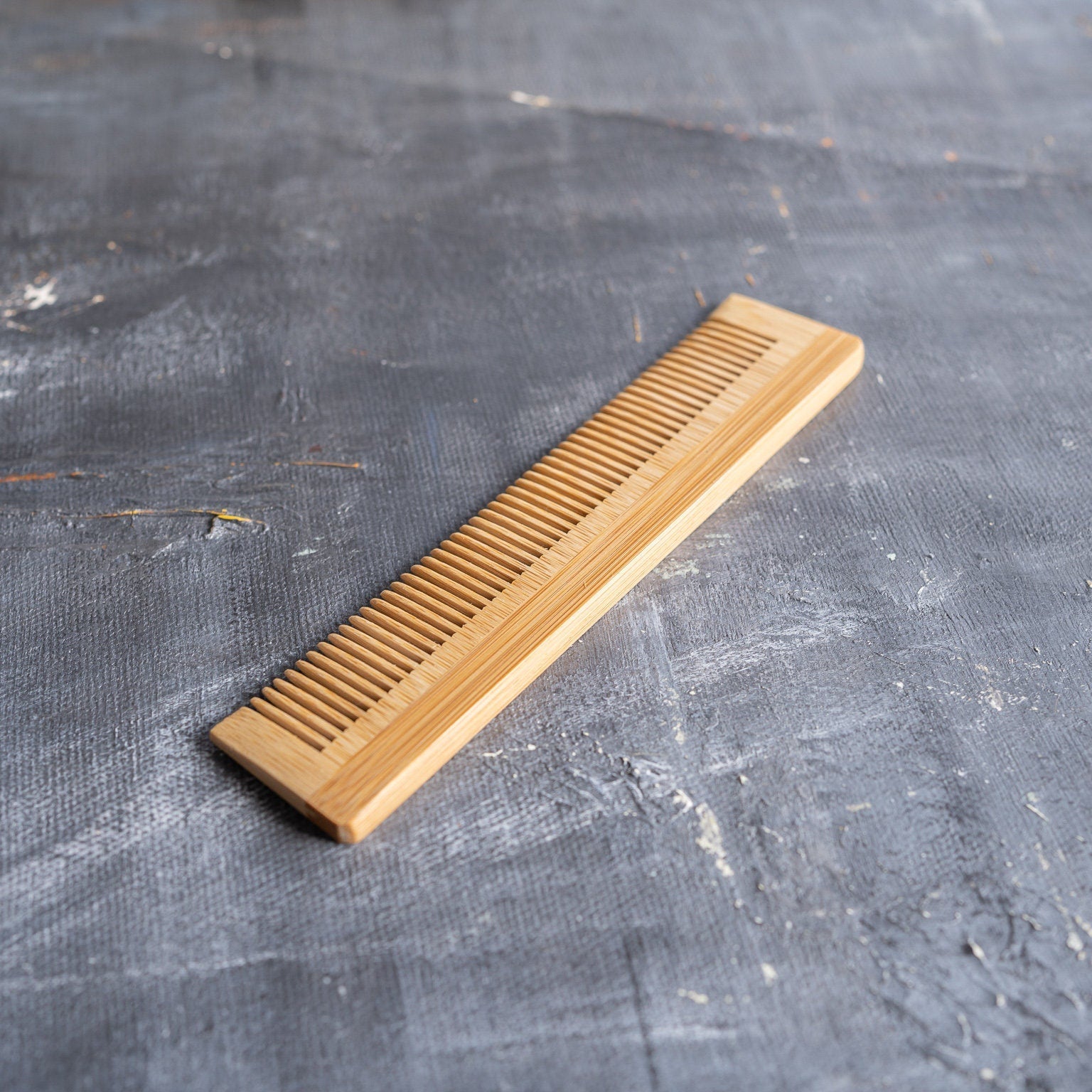 On-the-go bamboo hair brush set with detangling comb, cleaning tool, and reusable travel bag. — view 4
