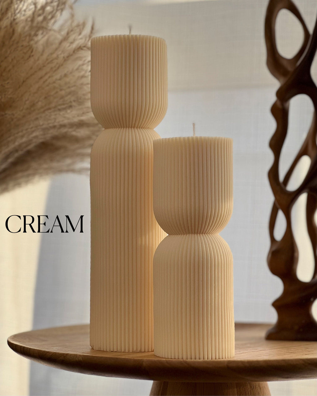 Hand-poured ribbed hourglass soy pillar candle showcasing minimalist sculptural design and natural cotton wicks — view 3