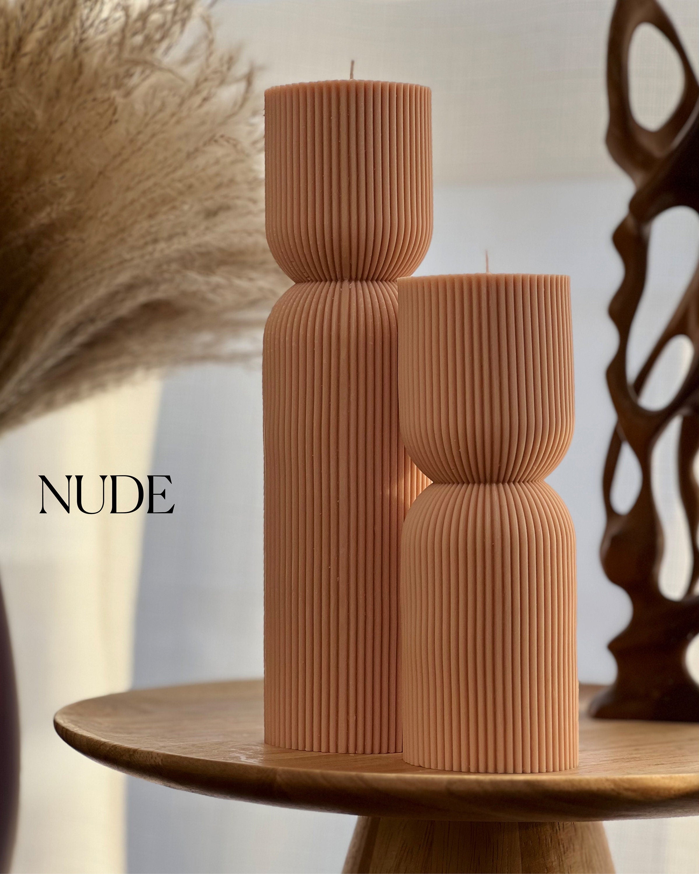 Hand-poured ribbed hourglass soy pillar candle showcasing minimalist sculptural design and natural cotton wicks — view 2
