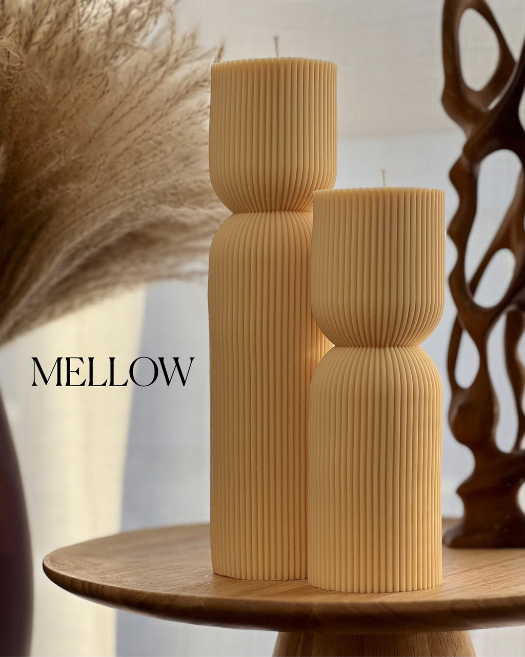 Hand-poured ribbed hourglass soy pillar candle showcasing minimalist sculptural design and natural cotton wicks — view 4