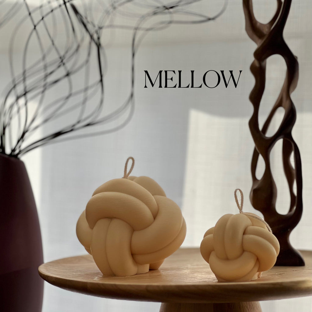 Minimalist knot soy candle in a twisted yarn ball shape, stylish neutral wax home decor — view 4