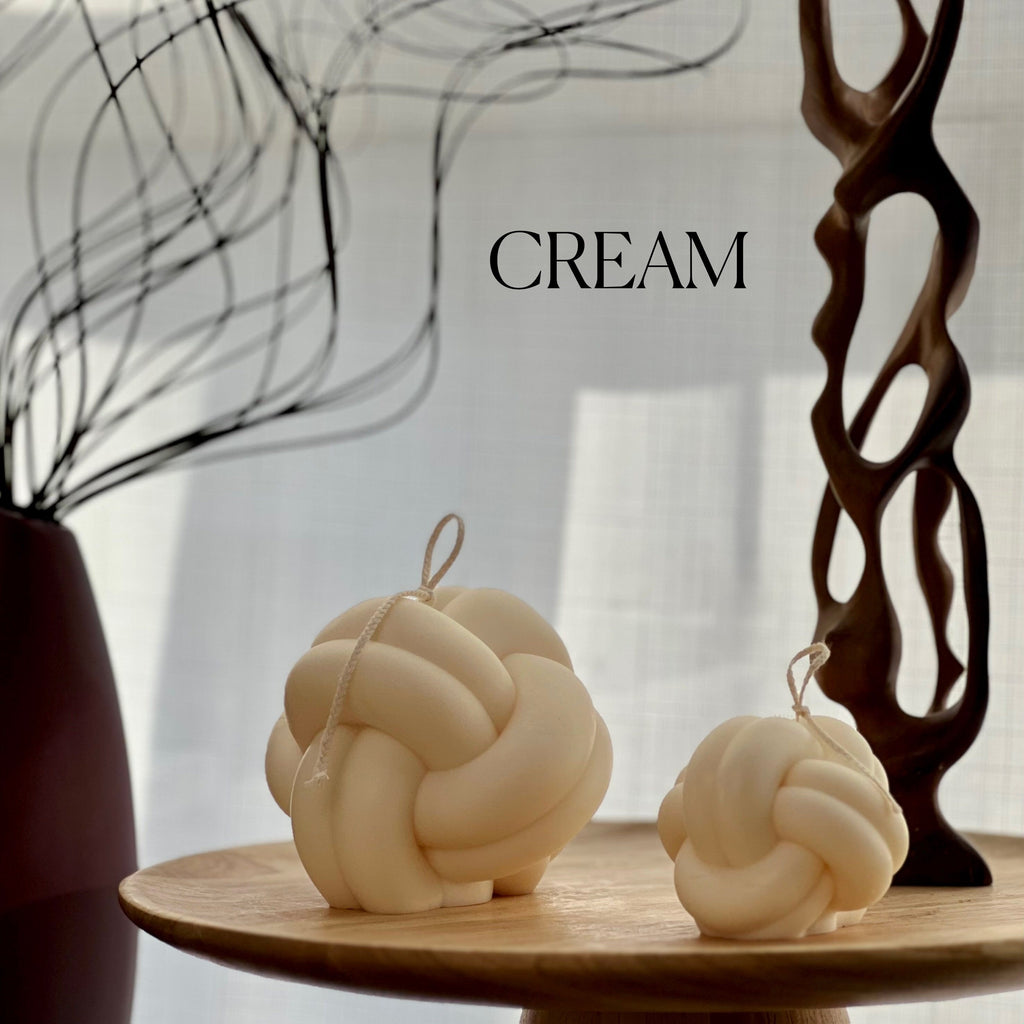Minimalist knot soy candle in a twisted yarn ball shape, stylish neutral wax home decor — view 3