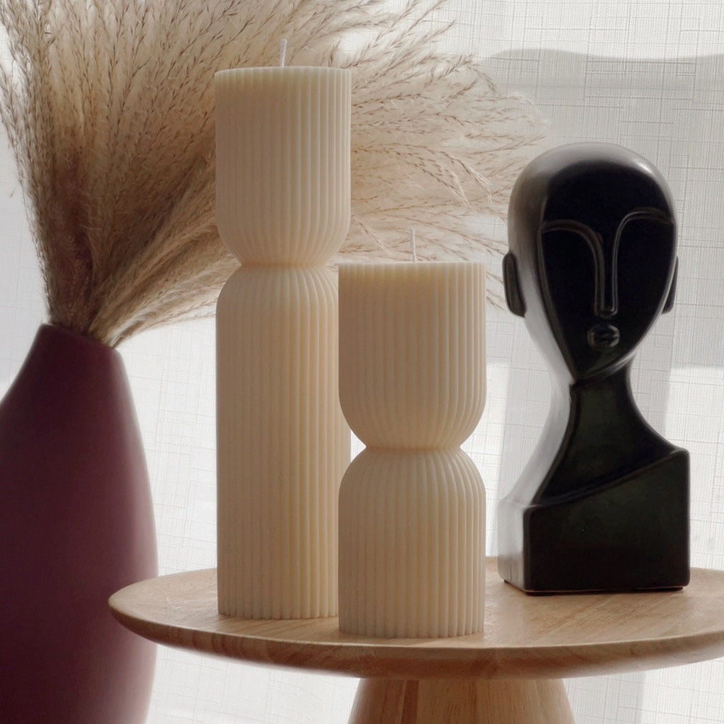 Ribbed hourglass pillar candle made of hand-poured sustainable soy wax with a natural cotton wick