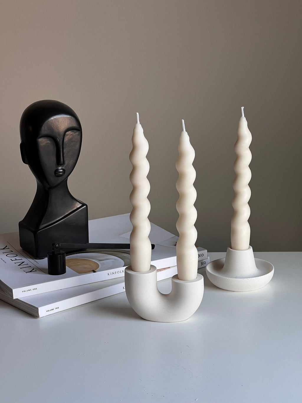 Minimalist handmade jesmonite double candlestick holder for taper candles on a modern dining table — view 4
