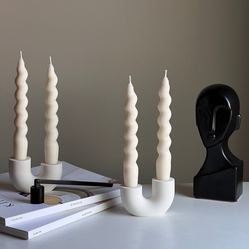 Minimalist handmade jesmonite double candlestick holder for taper candles on a modern dining table — view 2
