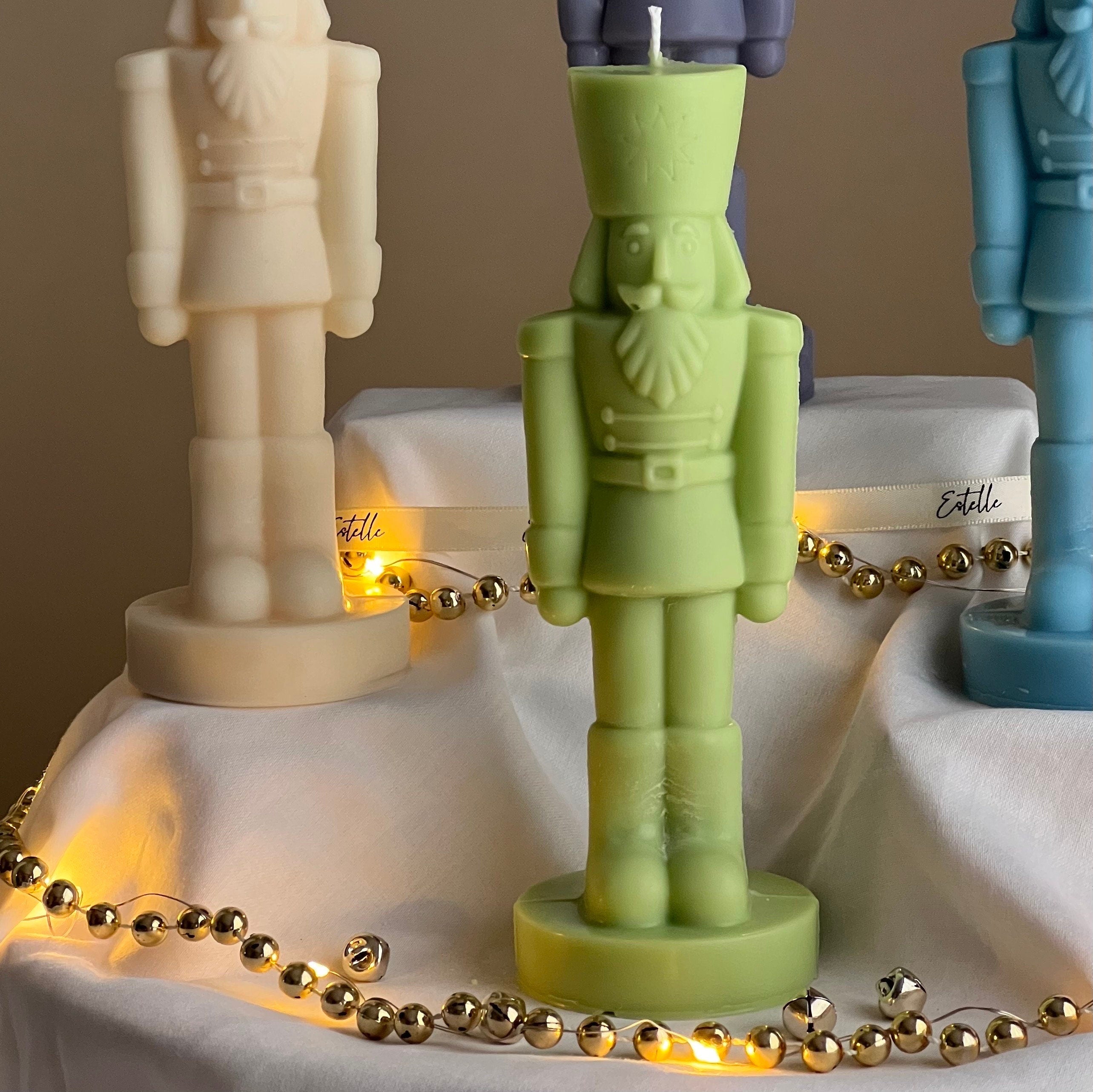 Handmade sculptural nutcracker candle made of solid soy wax for festive Christmas home decor displays — view 3