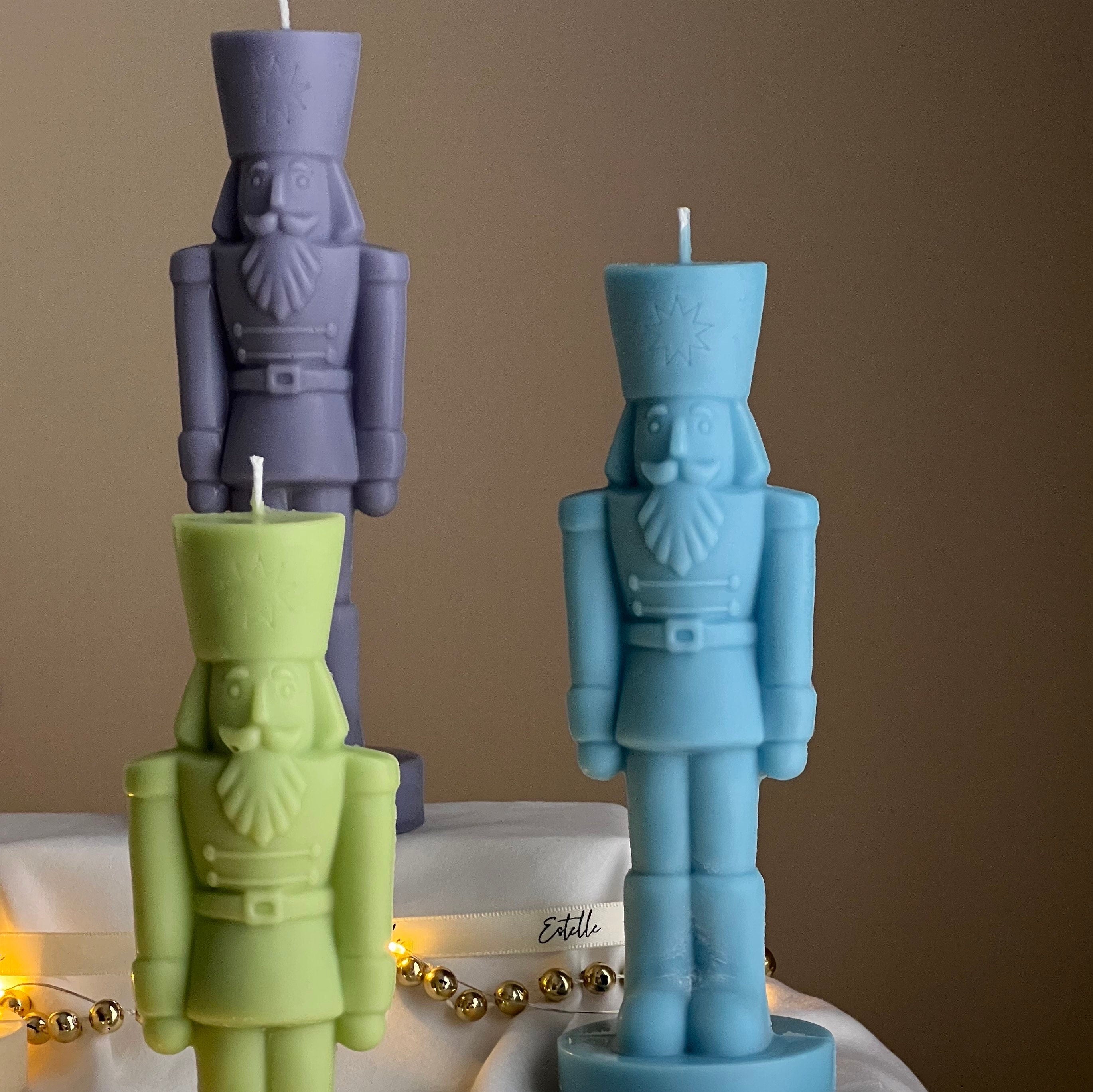 Handmade sculptural nutcracker candle made of solid soy wax for festive Christmas home decor displays — view 2
