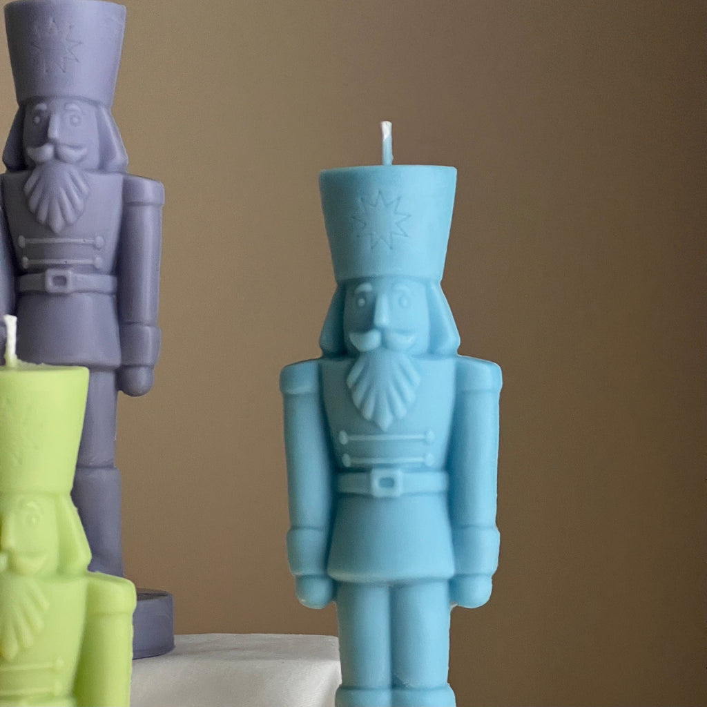 Handmade sculptural nutcracker candle made of solid soy wax for festive Christmas home decor displays — view 4