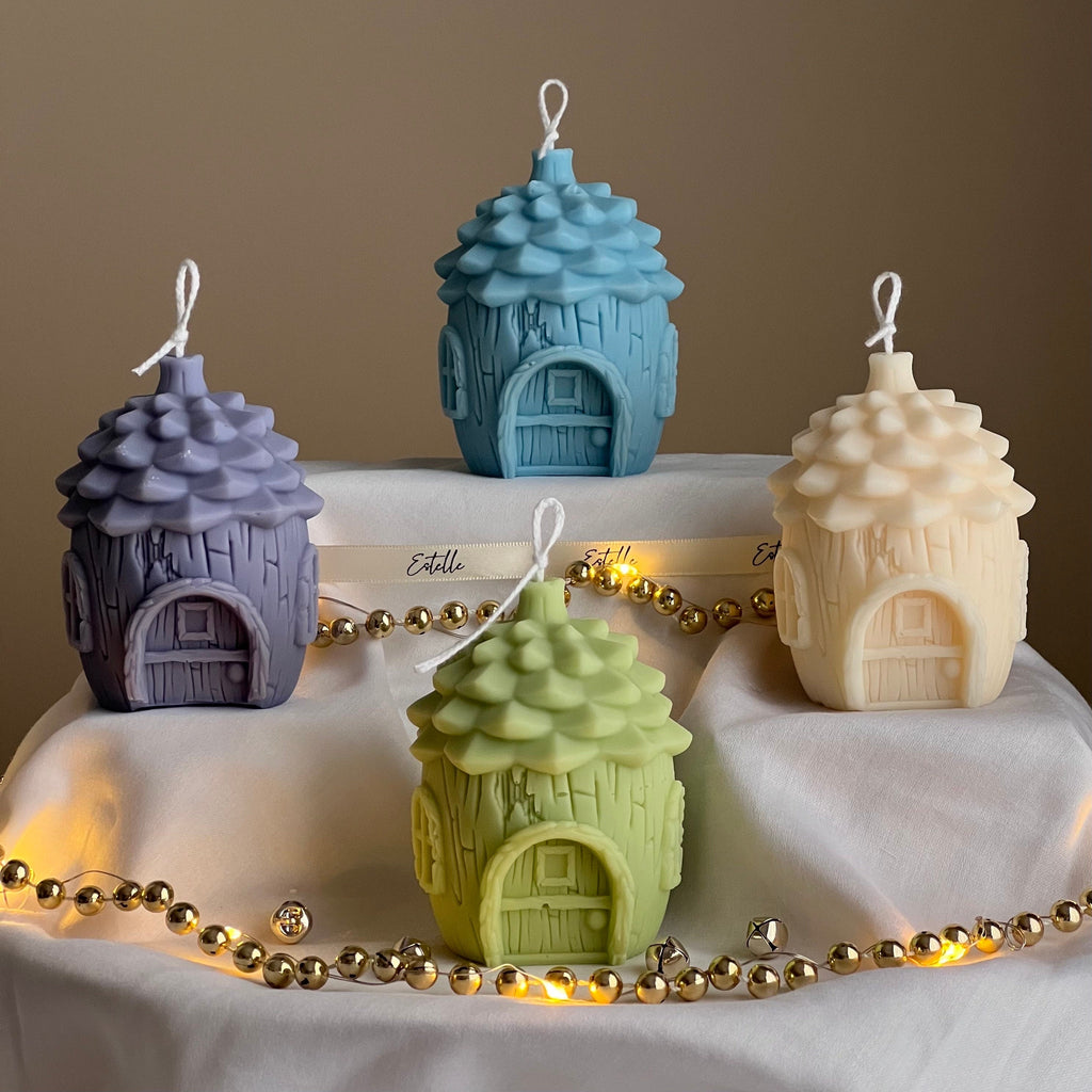 Handmade soy wax pine cone house candle for winter holiday and festive Christmas home decoration