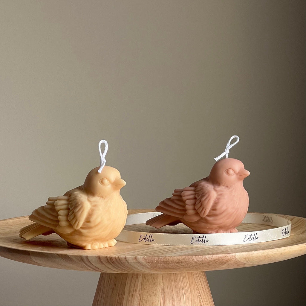 Handmade bird shaped soy wax decorative candle in a neutral pastel tone for home decor