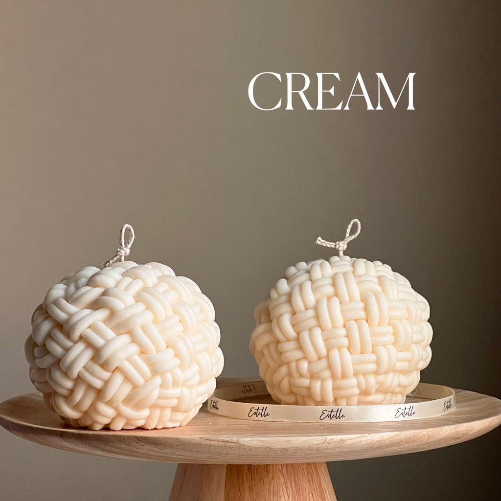Large handmade yarn ball candle made of vegan soy wax in a cozy home decor setting — view 3