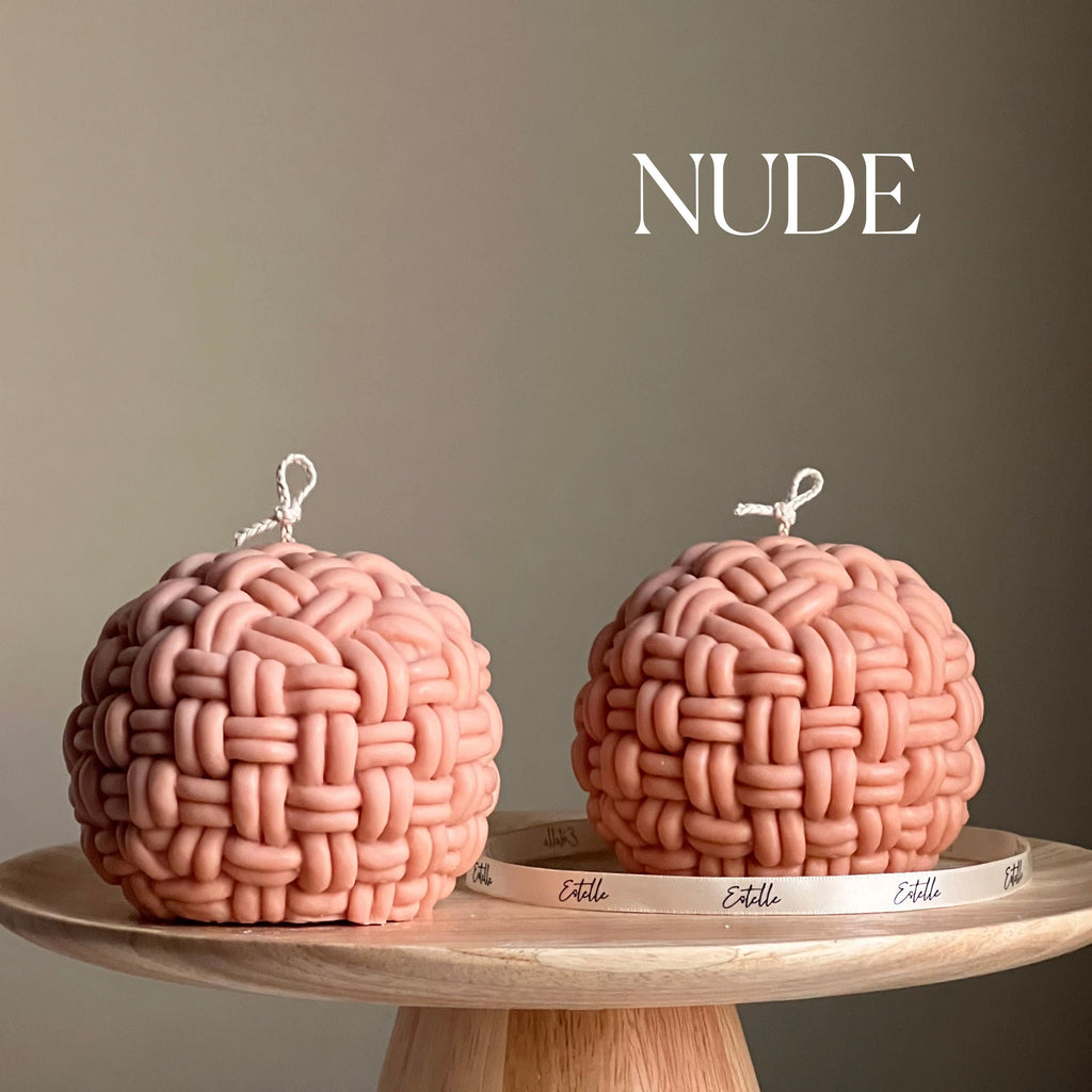 Large handmade yarn ball candle made of vegan soy wax in a cozy home decor setting — view 2