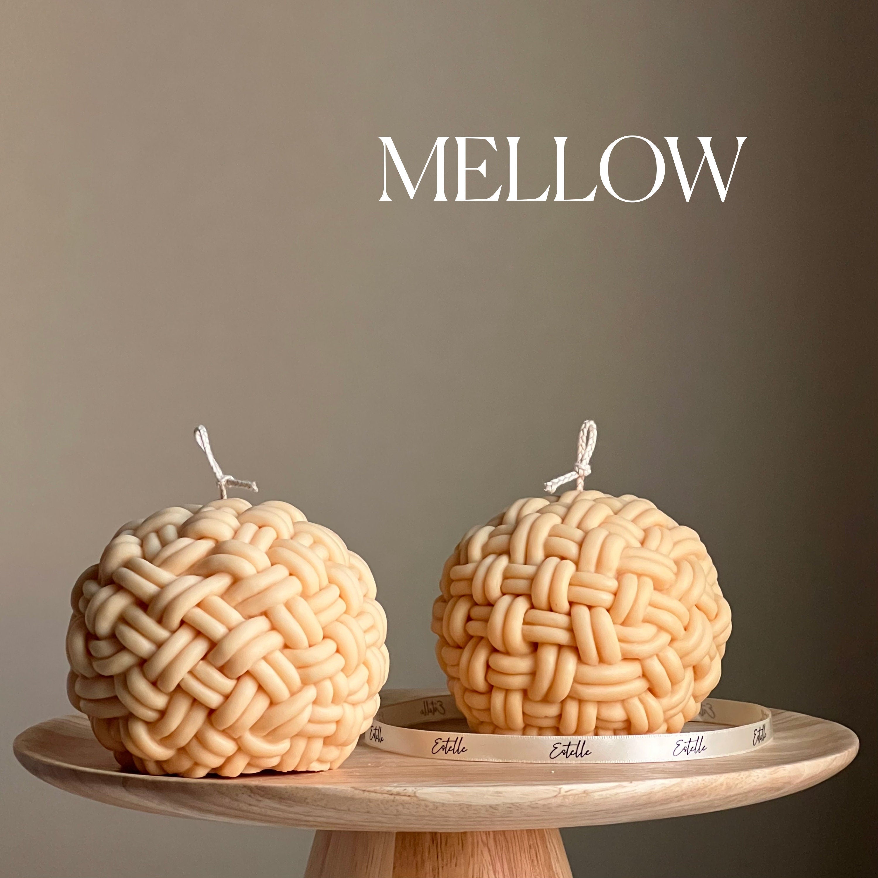 Large handmade yarn ball candle made of vegan soy wax in a cozy home decor setting — view 4