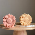 Handmade yellow sunflower shaped decorative pillar candle made from vegan soy wax on a table