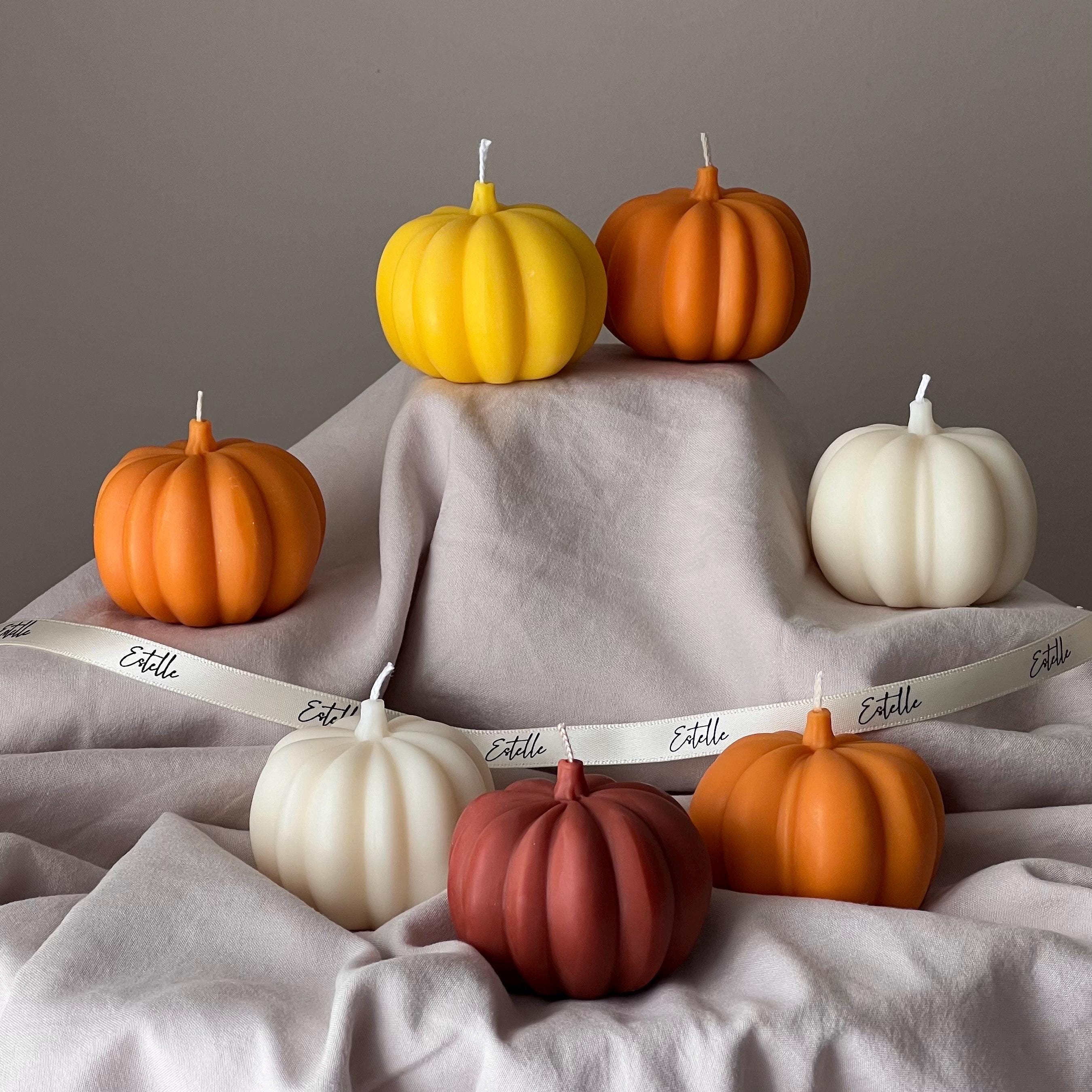 Handmade pumpkin shaped soy wax candle for autumn and halloween festive seasonal home decor