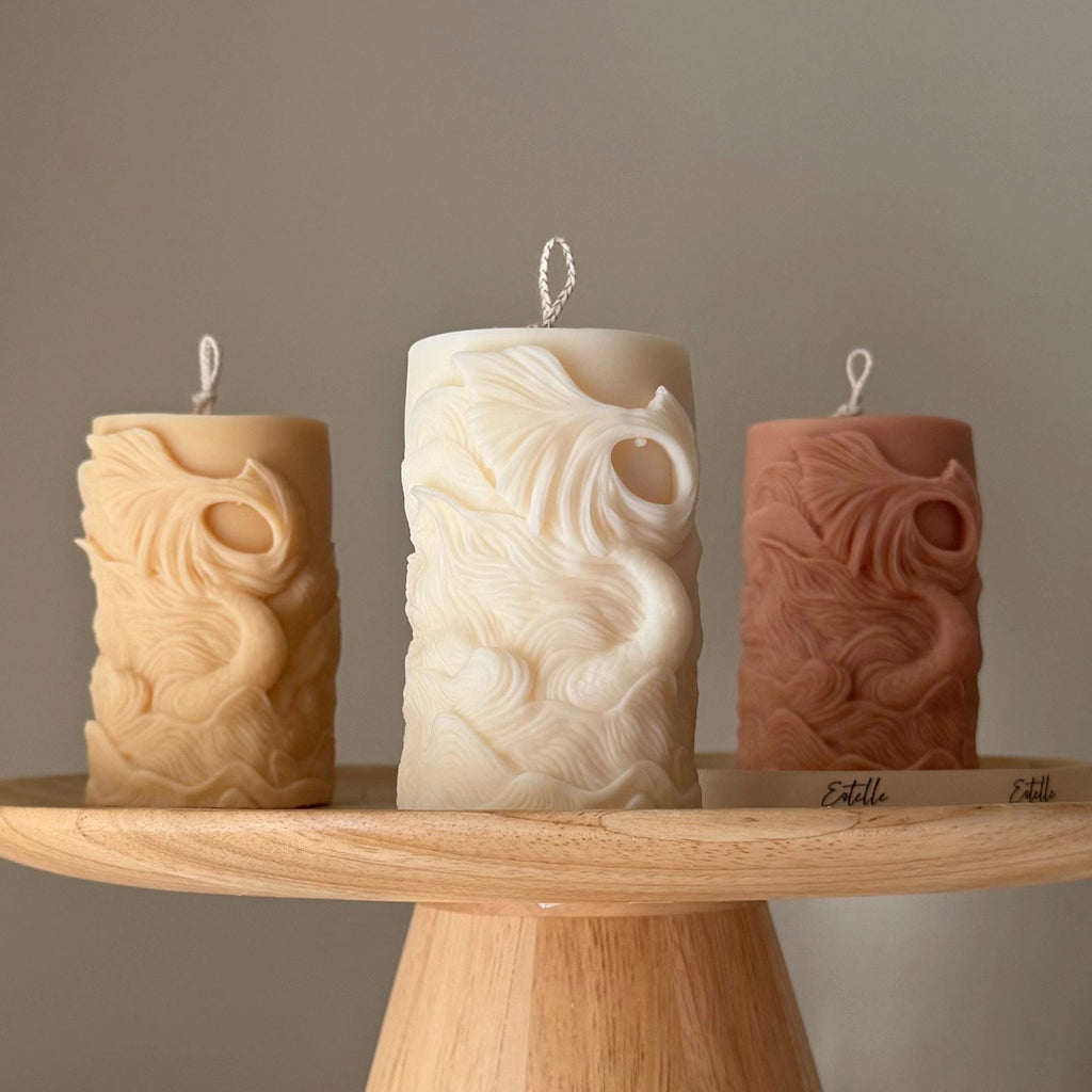 Ribbed fishtail sculptural soy pillar candle in neutral tone for modern aesthetic home decor
