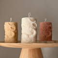Ribbed fishtail sculptural soy pillar candle in neutral tone for modern aesthetic home decor