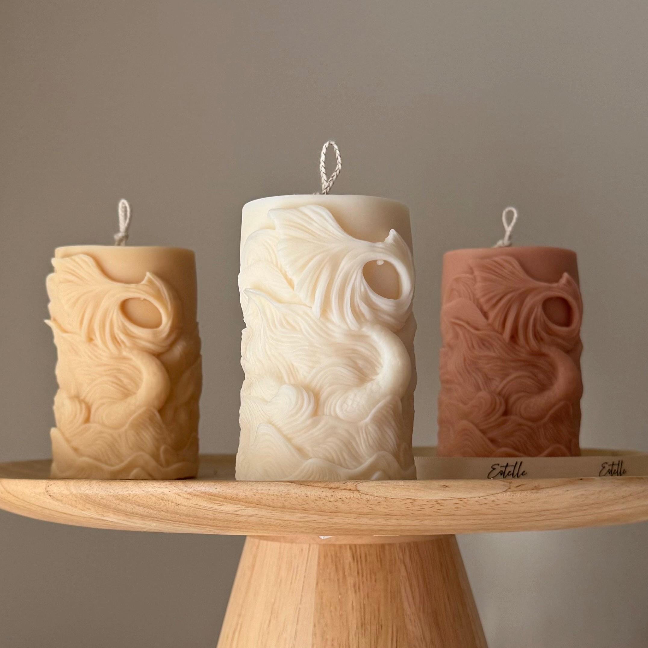 Ribbed fishtail sculptural soy pillar candle in neutral tone for modern aesthetic home decor