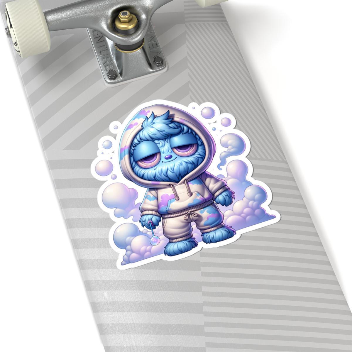 Glossy pastel vinyl sticker of a fluffy blue monster in a cloud hoodie holding an orb — view 2